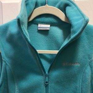 Woman’s light green fuzzy vest